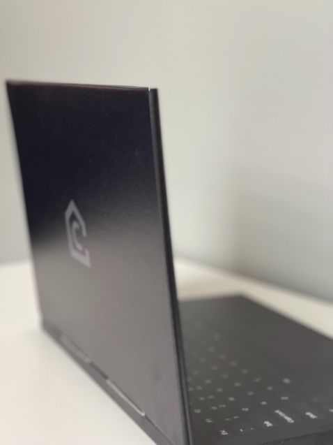 Cardboard laptop - notebook dummy. Very realistic appearance due to photo-realistic print of the cardboard QWERTY keyboard with trackpad and display | Cubiqz