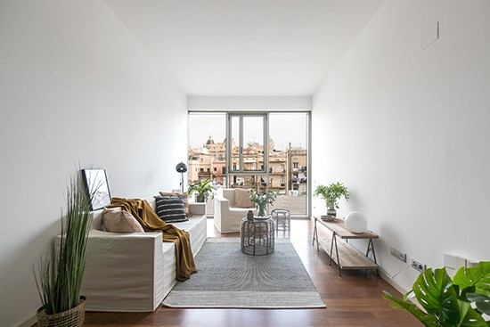 A Home BCN with Cubiqz cardboard couch and chair with off white fabric cover A Home BCN with Cubiqz cardboard couch and chair with off white fabric cover